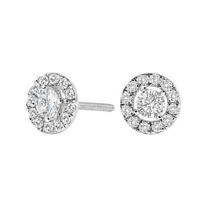 Front-facing view of white metal stud earrings with a central round white gemstone surrounded by smaller round white gemstones in prong settings.