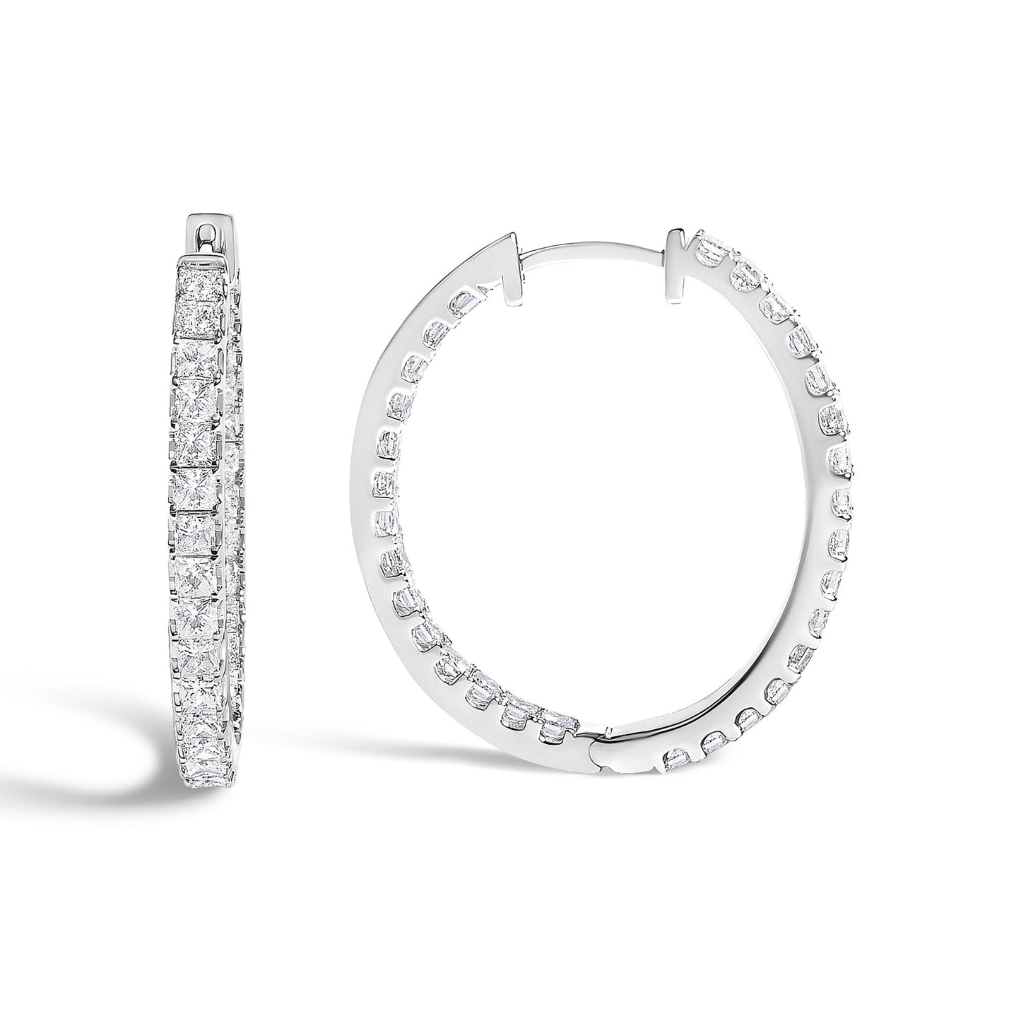 Close-up front and side angle of white hoop earrings adorned with princess-shaped white gemstones in prong settings.