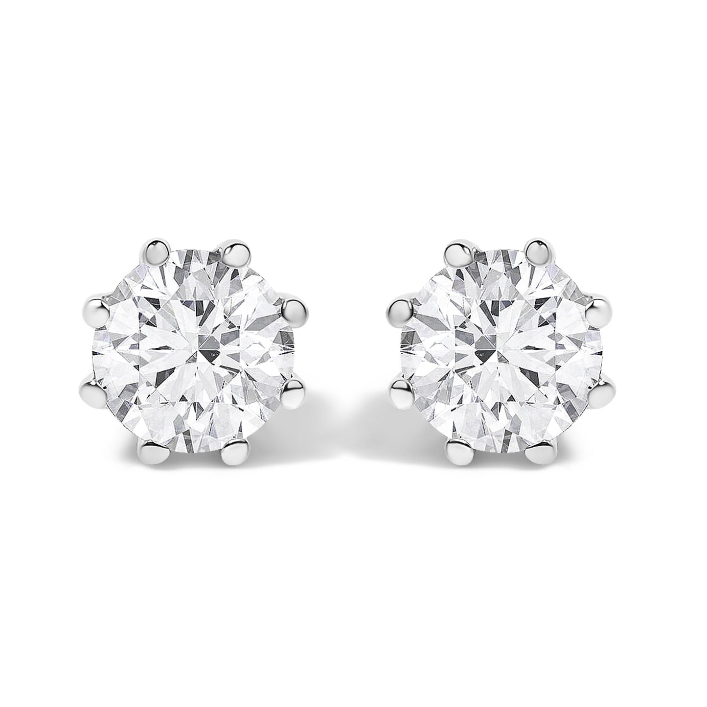 Front angled view of a pair of white metal stud earrings, each featuring a large round white gemstone in a prong setting.