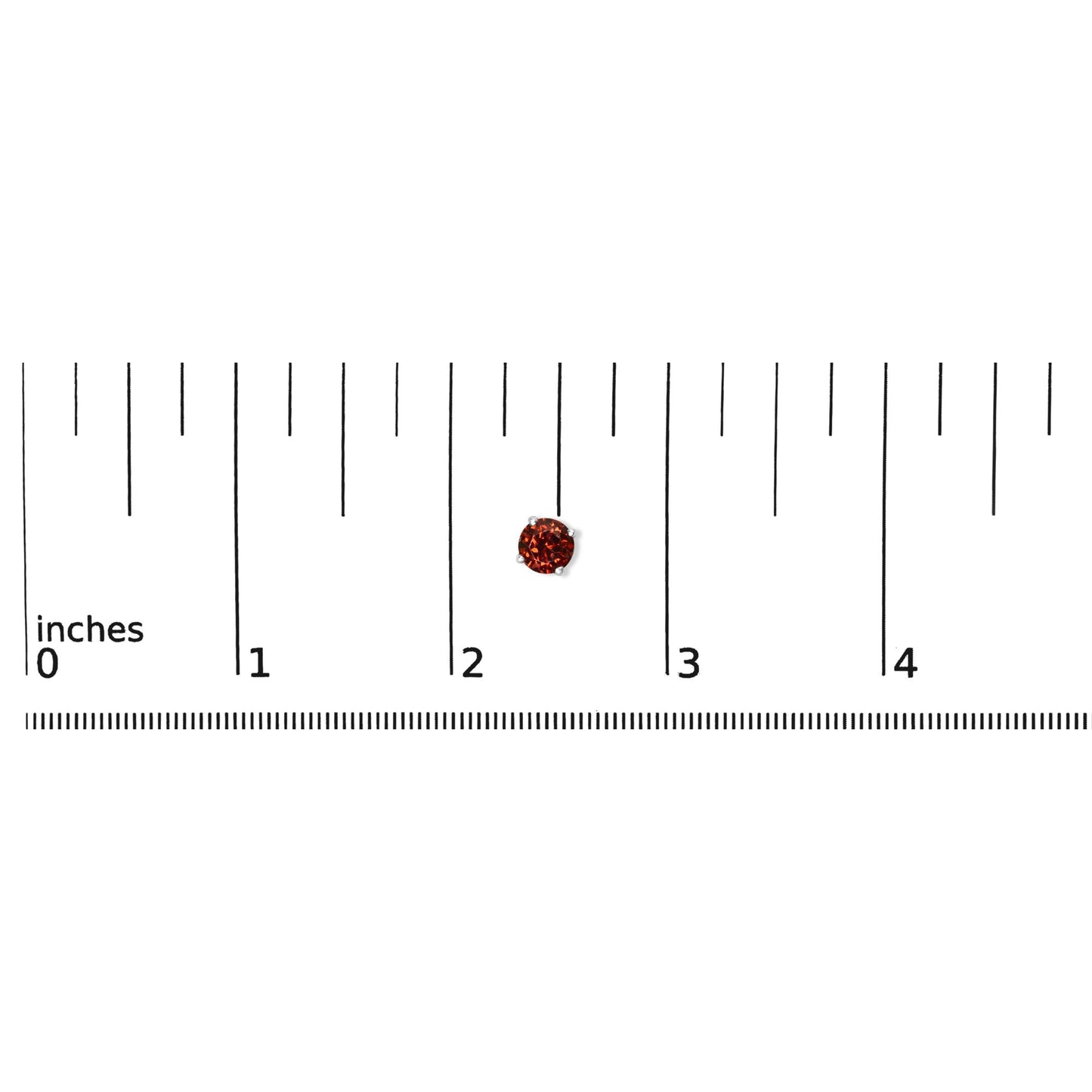 Close-up top view of a single round red gemstone earring in a four-prong white metal setting placed on a ruler for size reference.