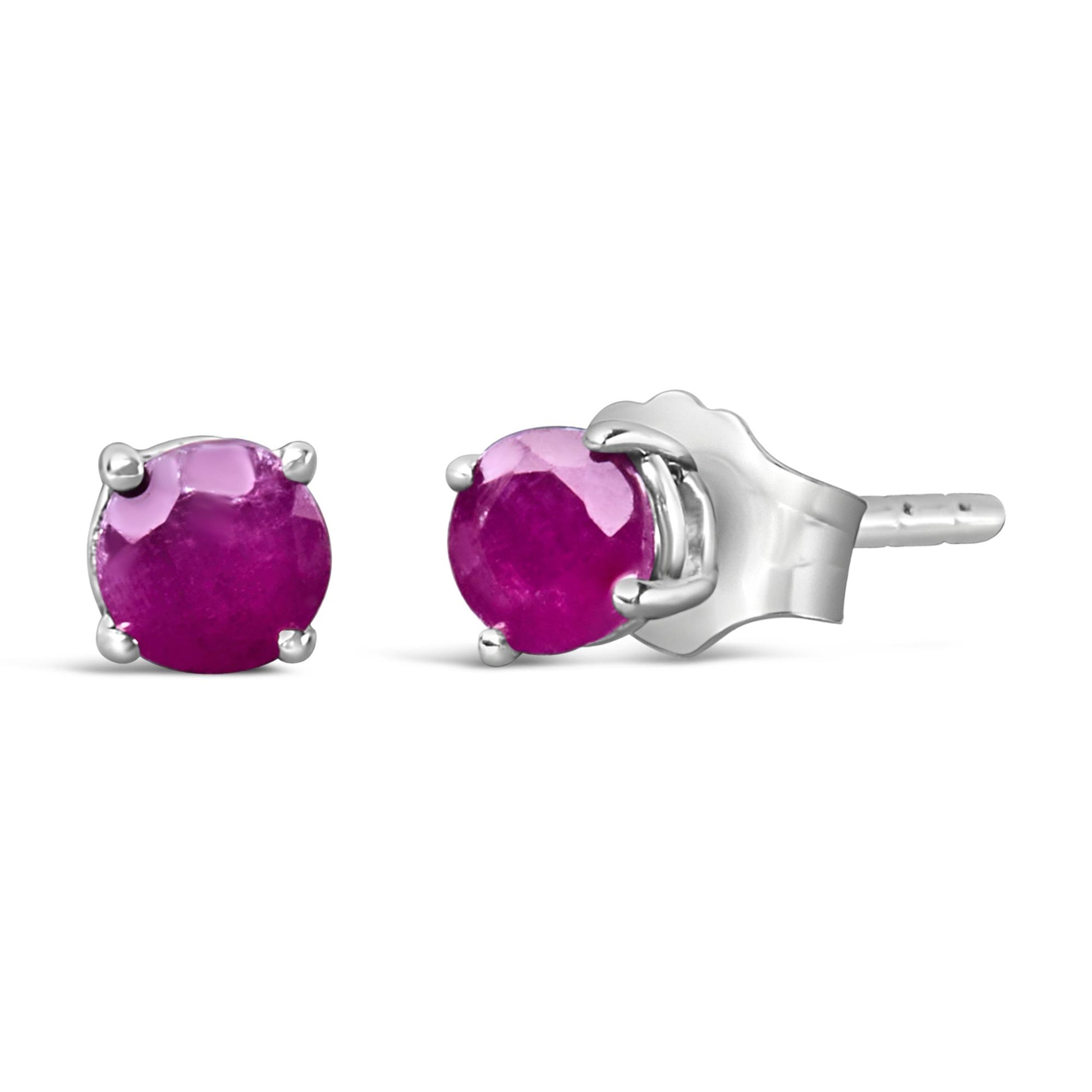 Pair of white metal stud earrings with round pink gemstones in four-prong settings, shown from front and side angles.