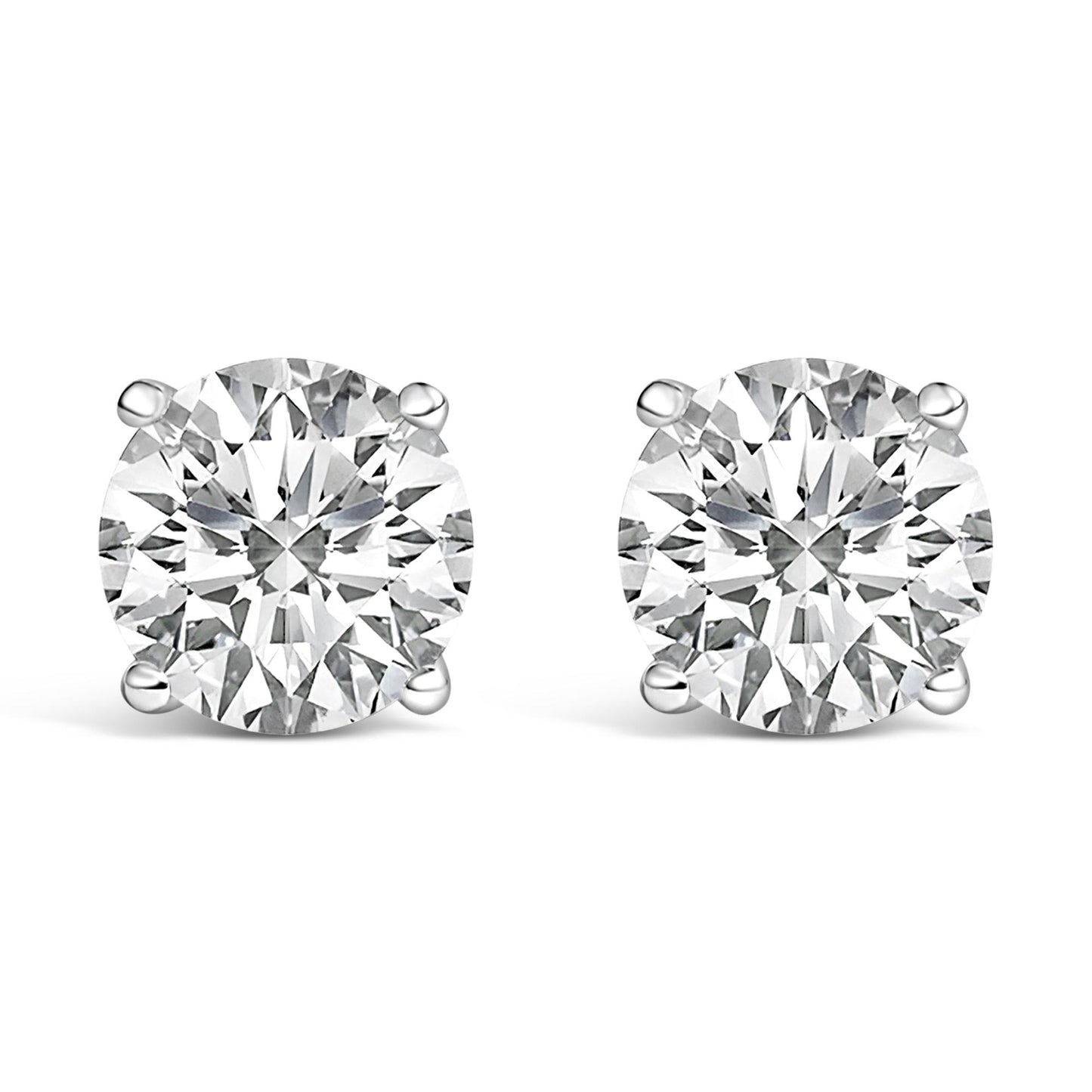 Pair of white metal stud earrings with round white gemstones in four-prong settings, shown in a front-facing close-up shot.