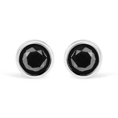 Front view of a pair of white metal stud earrings each featuring a round black gemstone in a bezel setting.