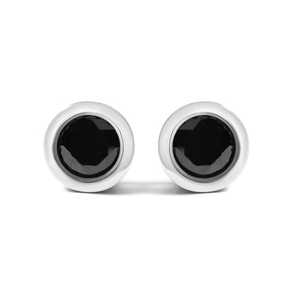 Front view of a pair of white metal stud earrings, each featuring a round black gemstone in a bezel setting.