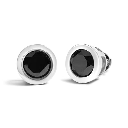 Pair of white metal round stud earrings with bezel-set black round gemstones, shown in a front and slightly angled side view on a white background.