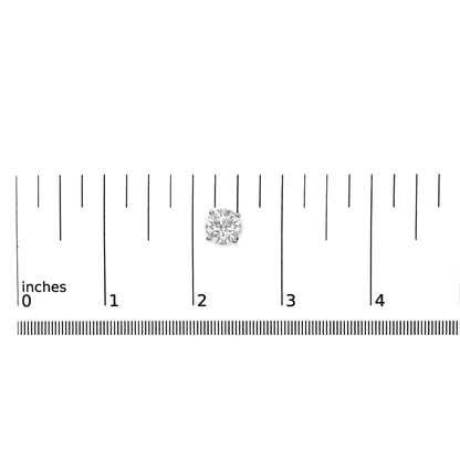 Close-up front angle of a single white metal earring with a round white gemstone in a 4-prong setting, shown on a ruler scale.