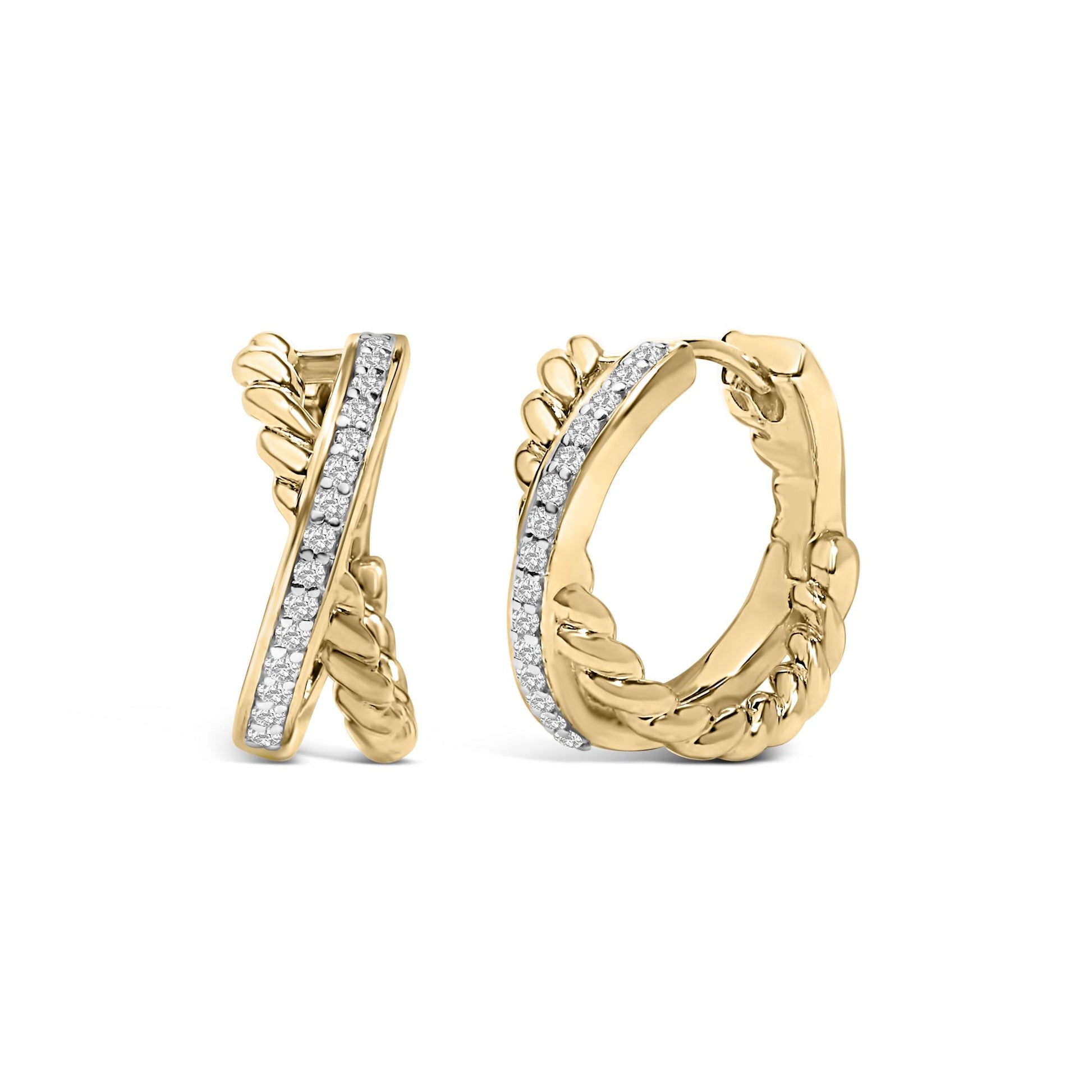 Close-up front angled view of a pair of yellow metal hoop earrings with a braided design along the outer edge and a row of round white gemstones set in a prong setting along the front.