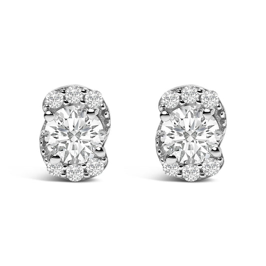 Front view of a pair of white metal earrings featuring a larger round white gemstone in the center surrounded by smaller round white gemstones in a prong setting.