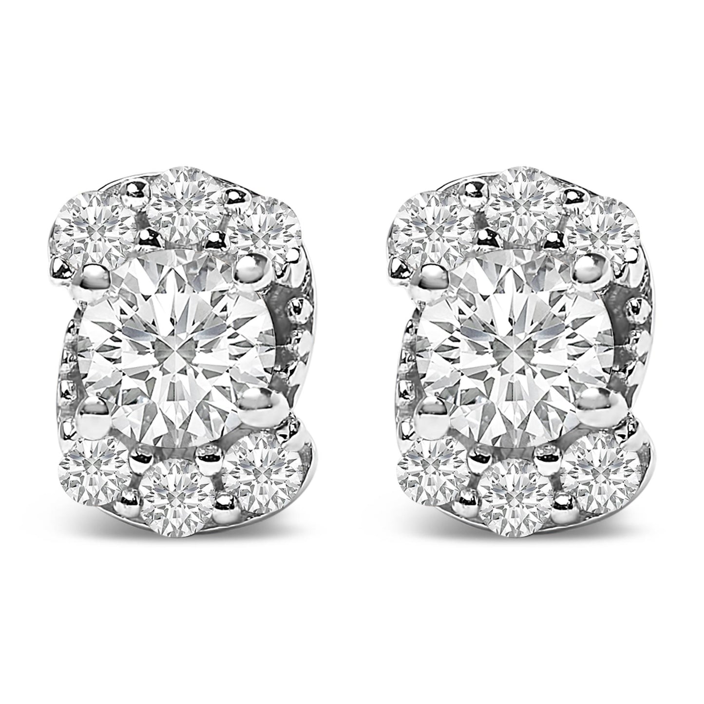 Close-up front view of a pair of white metal stud earrings featuring a large central round white gemstone surrounded by smaller round white gemstones in prong settings.