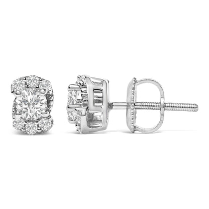 Pair of white metal stud earrings shown from front and side angles, featuring a central round white gemstone surrounded by smaller round white gemstones in prong settings.