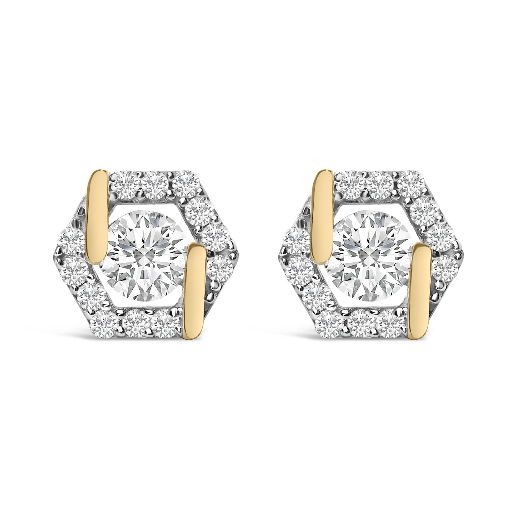 Pair of yellow metal hexagonal earrings with a large round white gemstone in the center, surrounded by smaller round white gemstones, shown in a front-facing close-up view.