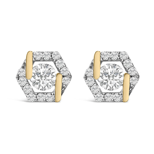 Pair of yellow metal hexagonal earrings with a large round white gemstone in the center, surrounded by smaller round white gemstones, shown in a front-facing close-up view.