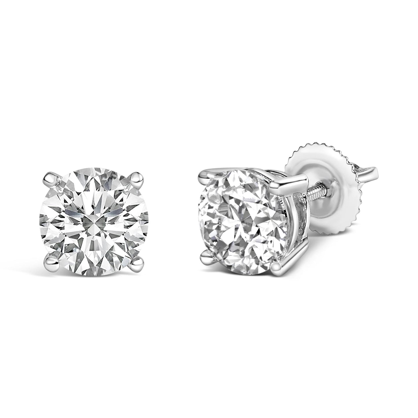 Pair of white metal stud earrings with round white gemstones in four-prong settings, one shown from the front and the other at a side angle.