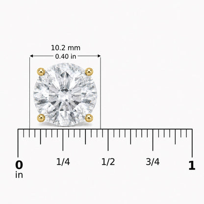 Close-up front view of a round white gemstone earring set in yellow metal with a 4-prong setting, shown on a scale with measurements in inches and millimeters.