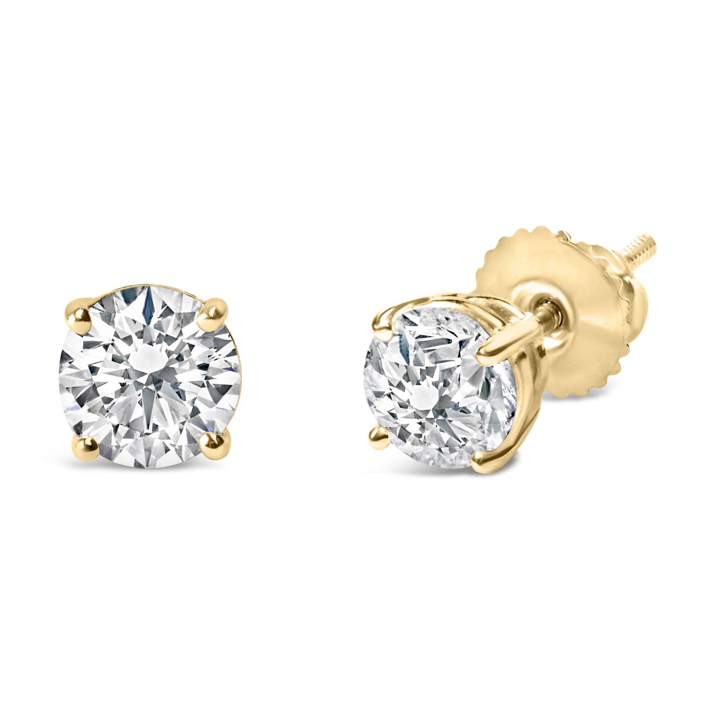 Close-up front and side angle of yellow metal stud earrings with round white gemstones in four-prong settings.