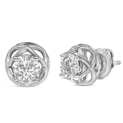 Close-up front and side view of a pair of white metal earrings displaying round white gemstones in a prong setting.