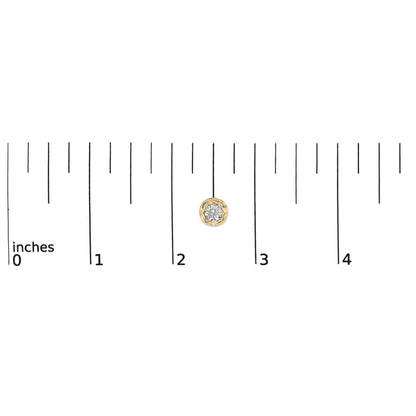 Close-up front view of a single yellow metal earring with a round white gemstone in a prong setting, shown on a scale.