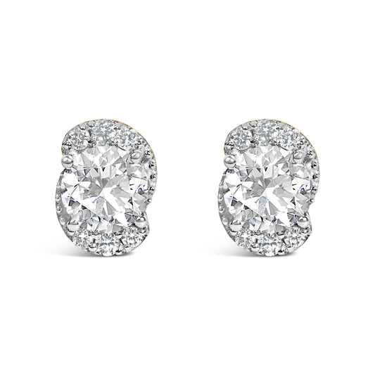 Close-up front view of a pair of yellow metal earrings with large round white gemstone centers surrounded by smaller round white gemstones in prong settings.