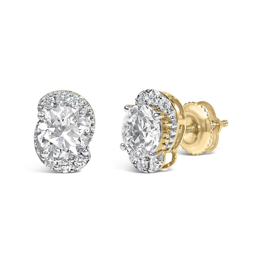 Close-up front angle of a pair of yellow metal earrings with a central round white gemstone surrounded by smaller round white gemstones in prong settings.