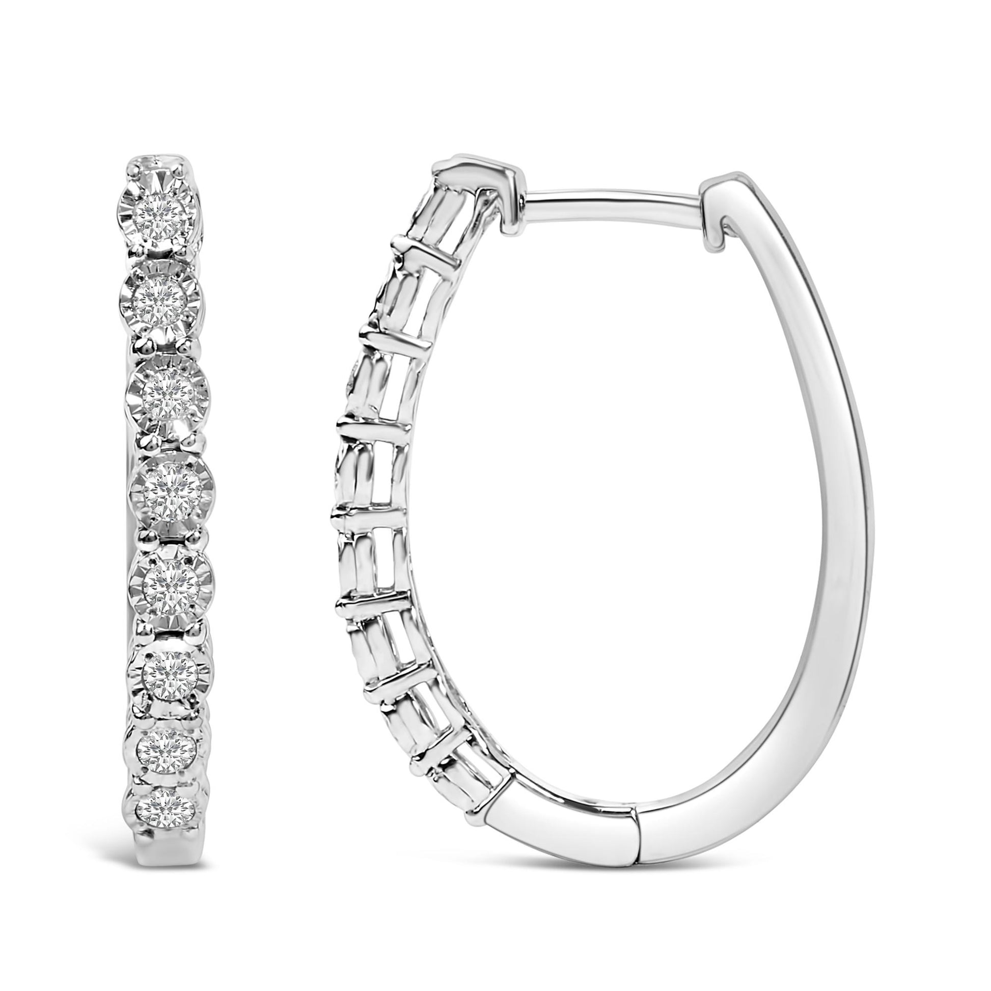 Front and side views of a pair of white metal hoop earrings with round white gemstones set in a row, shown on a white background.
