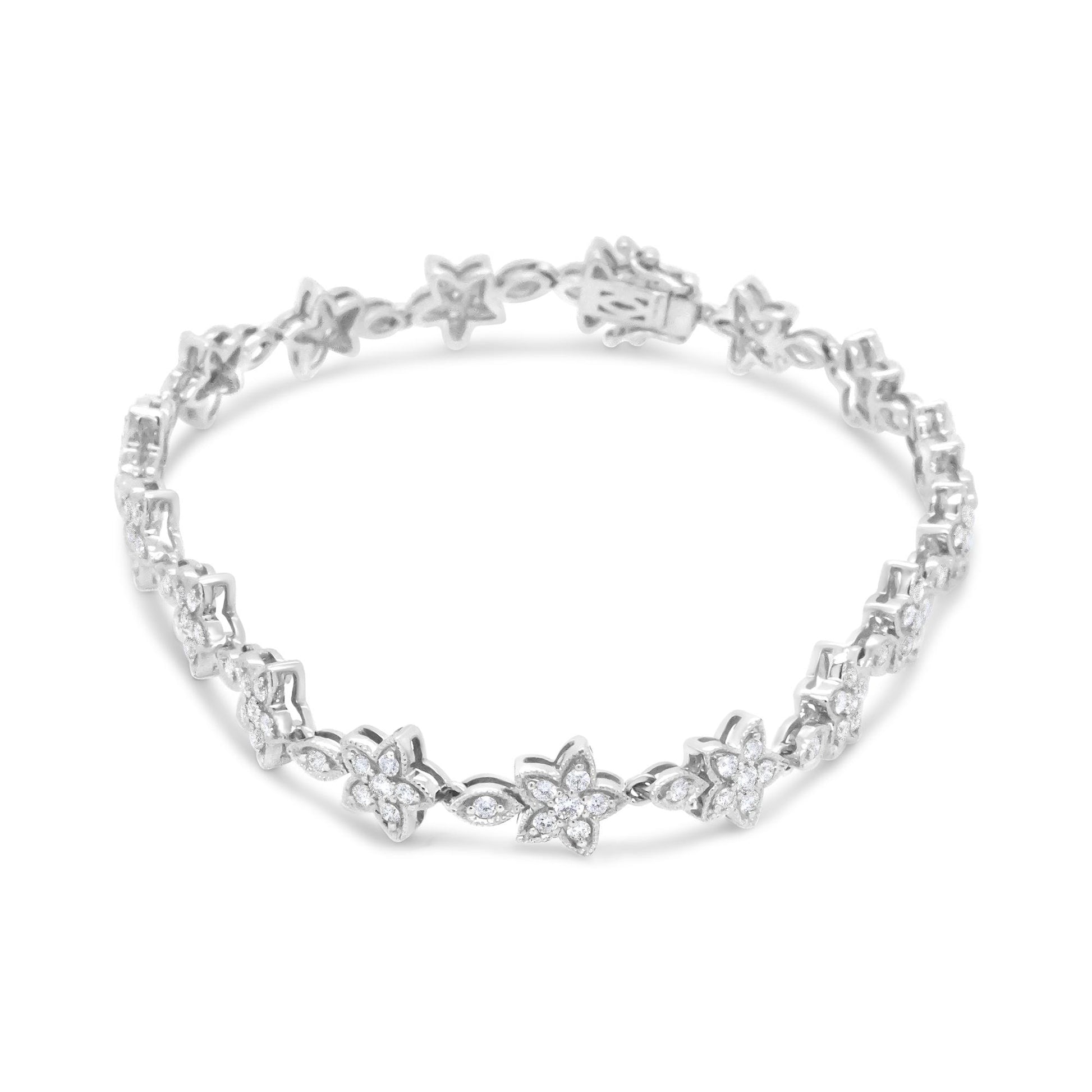 White metal bracelet with flower-shaped links set with round white gemstones, shown from a front angle.