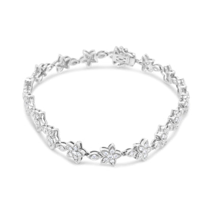 White metal bracelet with flower-shaped links set with round white gemstones, shown from a front angle.