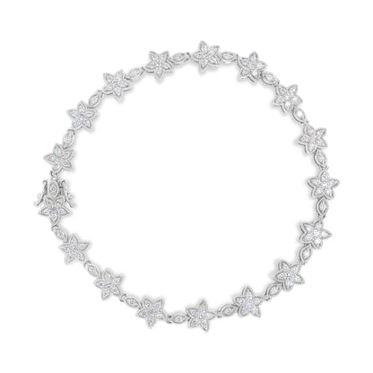 Top-down view of a white metal bracelet featuring alternating flower and marquise-shaped links, each adorned with white round gemstone prong settings.
