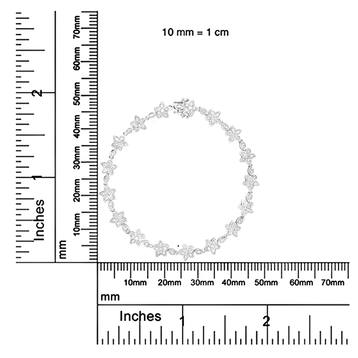 Top-down view of a white metal bracelet with flower-shaped links adorned with white round gemstones, displayed on a ruler for size reference.