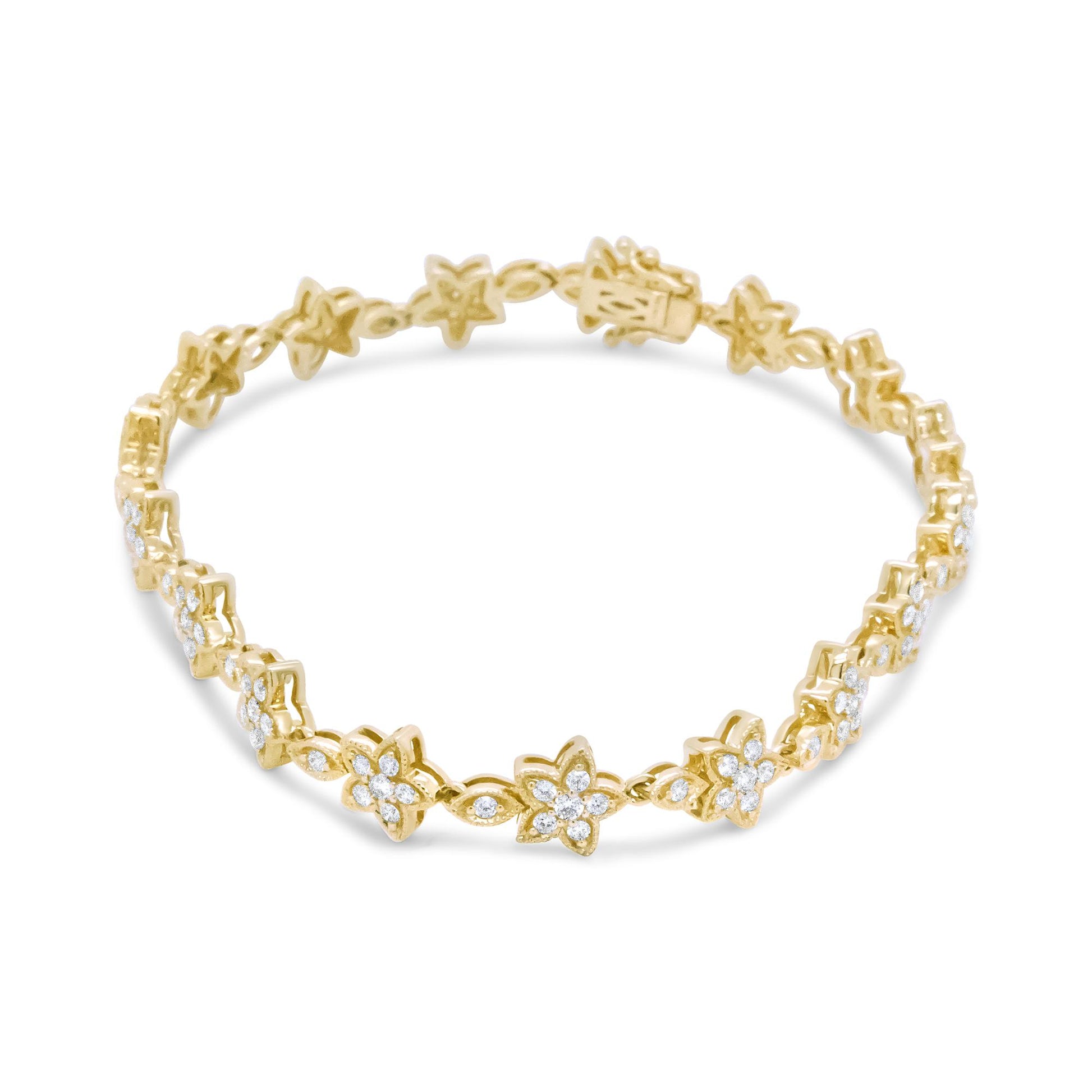 Yellow metal bracelet with flower and leaf shapes adorned with white gemstones, shown in a front angled view.