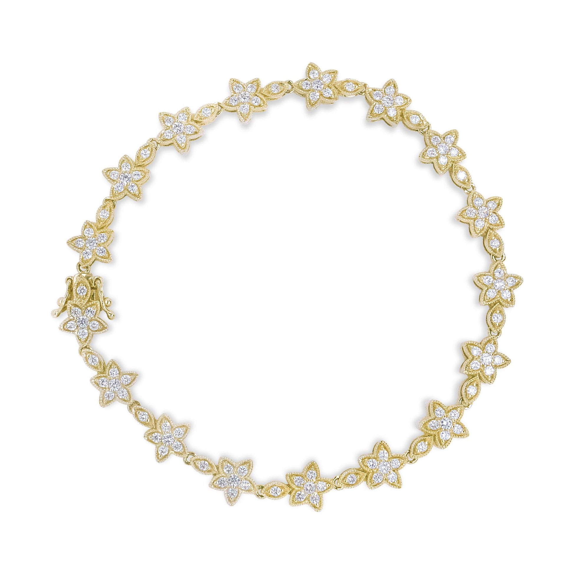 Top-down view of a yellow bracelet featuring flower-shaped designs with white round prong-set gemstones.