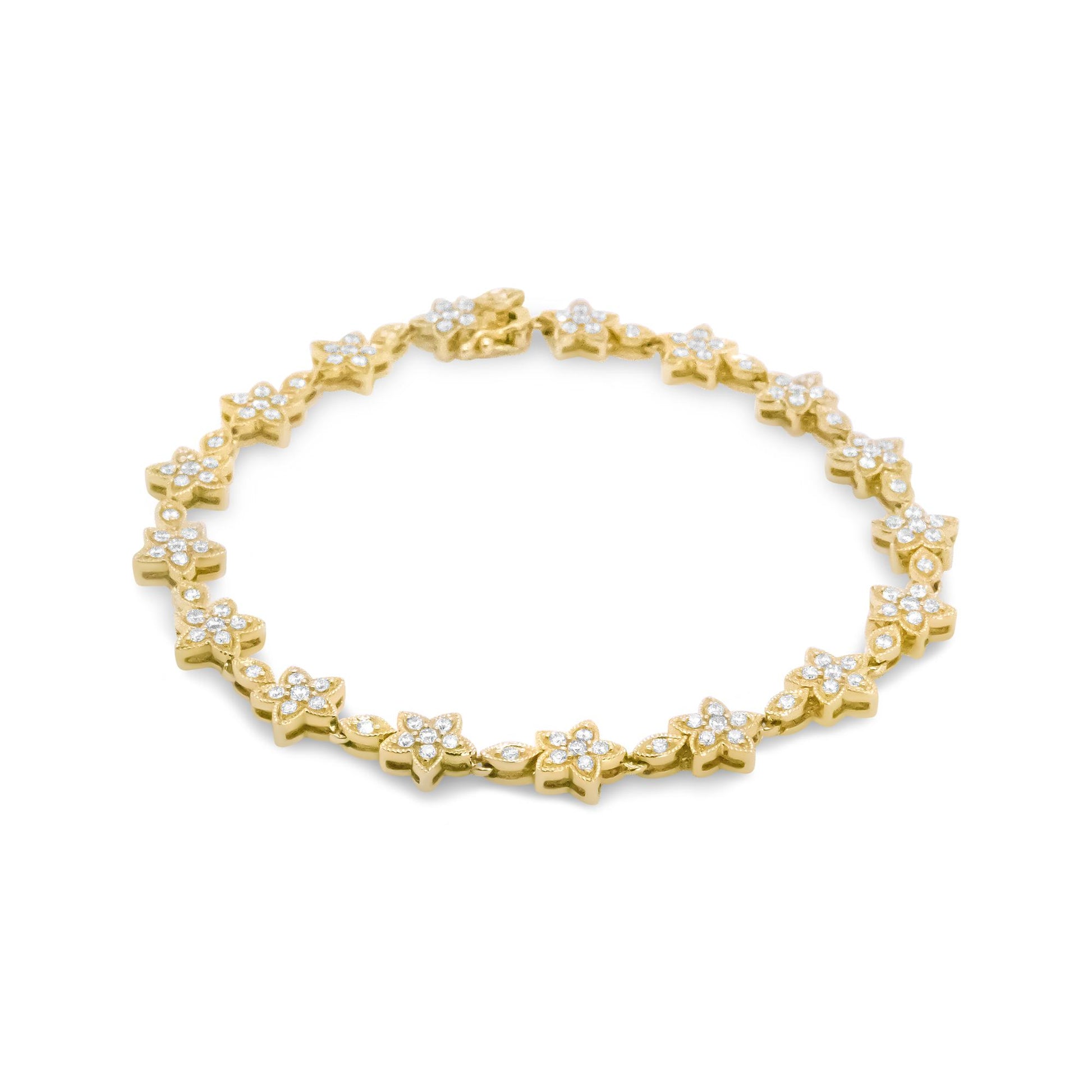Yellow metal bracelet with flower-shaped links set with round white gemstones, shown in a flat lay front angle.
