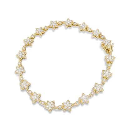 Top-down view of a yellow bracelet composed of floral-shaped links, each set with round white gemstones in prong settings.