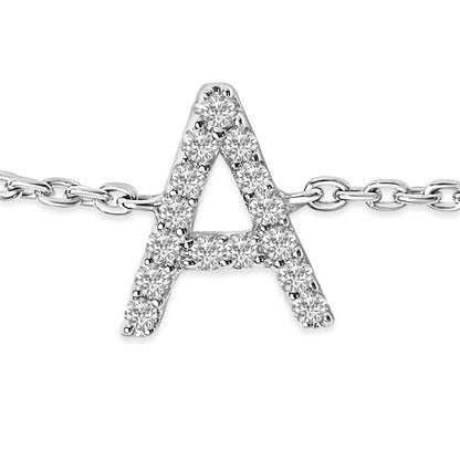 Close-up front view of a white metal bracelet featuring a pendant shaped like the letter A adorned with round white gemstones in a micro-pave setting.