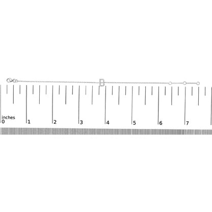 White metal bracelet with a letter-shaped charm set with white round gemstones in micro-pave setting, shown flat on a ruler scale from a top-down angle.