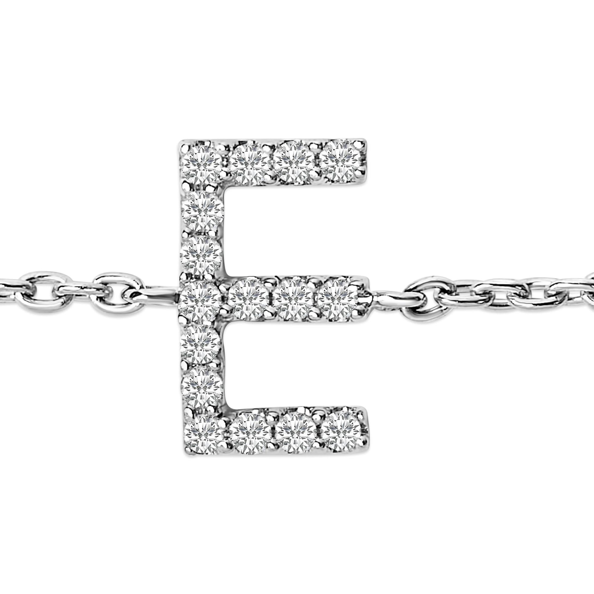 Close-up front view of a white bracelet with a letter 'E' pendant adorned with round white gemstones in a micro-pave setting, attached to a linked chain.