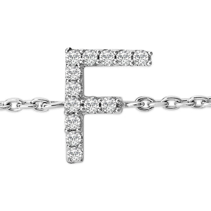 Close-up front angle of a white metal bracelet featuring a pendant in the shape of the letter 'F' adorned with white gemstones in a micro-pave setting, shown against a white background.