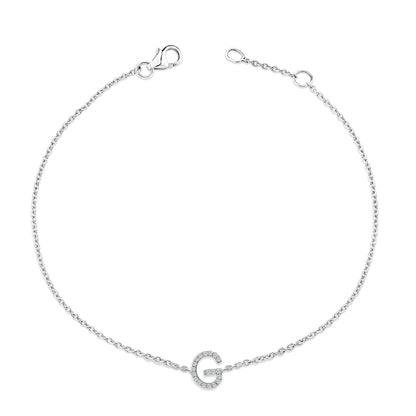 White bracelet with a delicate chain and a circular charm encrusted with white round gemstones in a micro-pave setting, shown from a top-down angle.