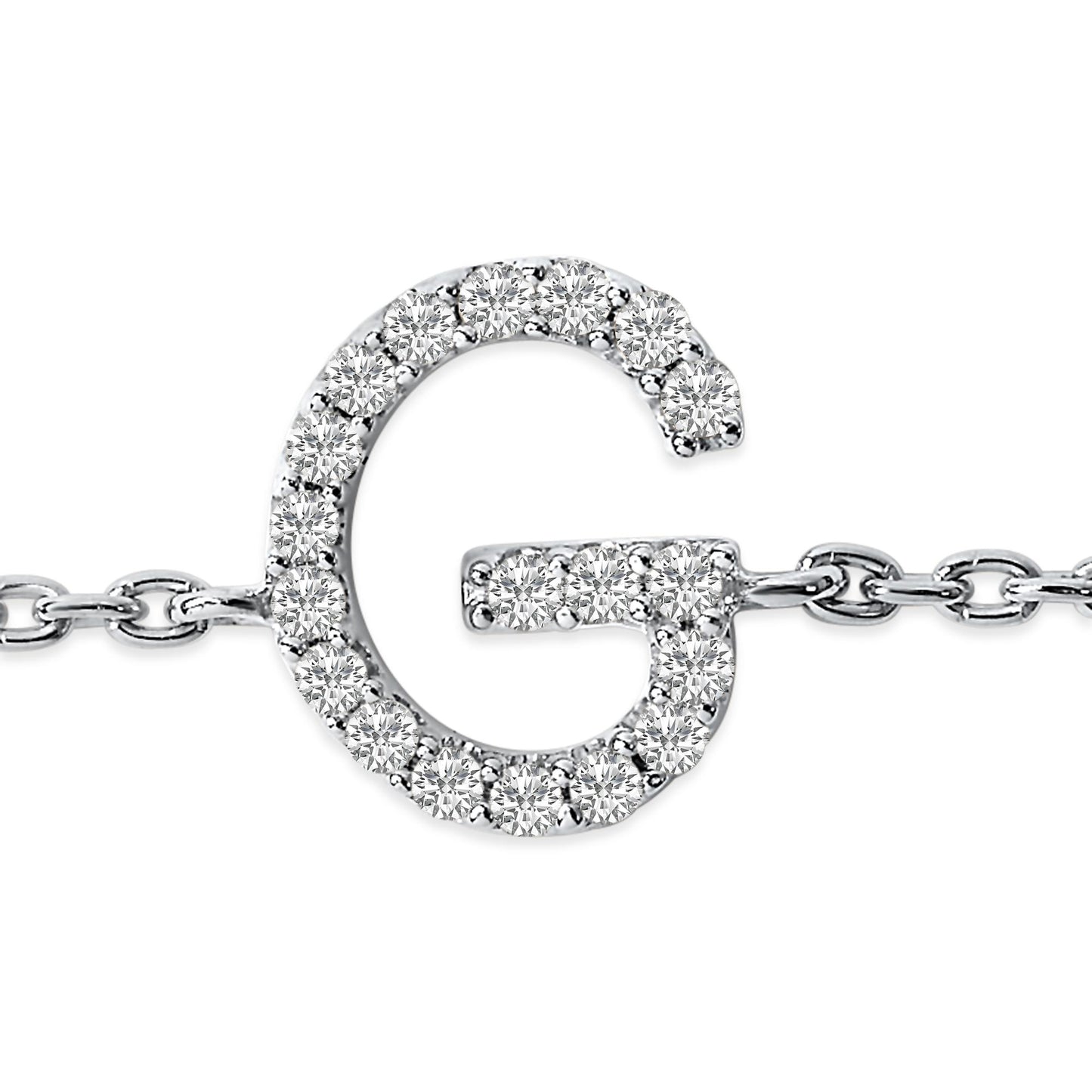 Close-up front view of a white metal bracelet featuring a 'G' shaped charm adorned with small round white gemstones in a micro-pave setting, attached to a link chain.