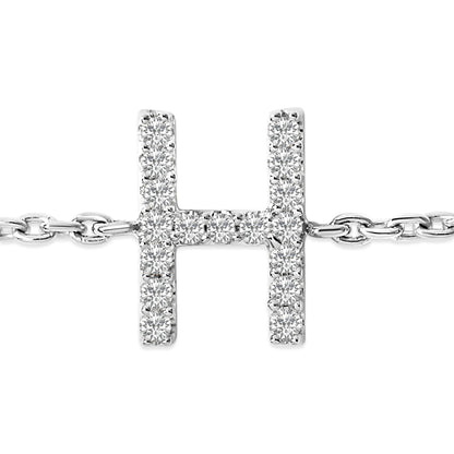 Close-up front view of a white metal bracelet featuring a horizontal H-shaped centerpiece adorned with round white gemstones in a micro-pave setting, shown on a white background.