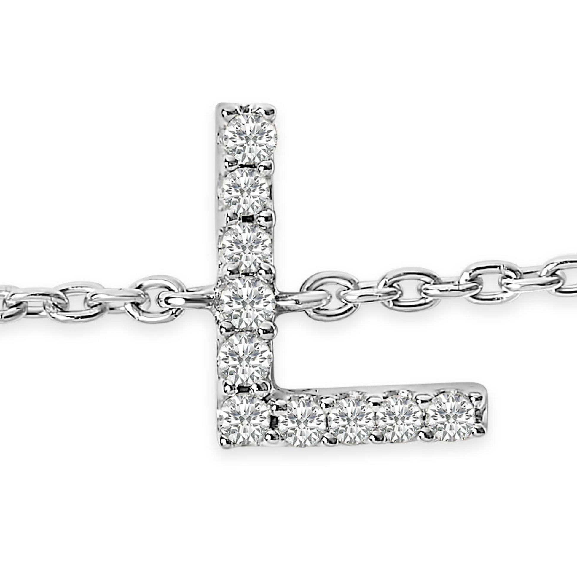 Close-up front angle of a white metal bracelet with an L-shaped pendant adorned with round white gemstones in a micro-pave setting, displayed on a chain.