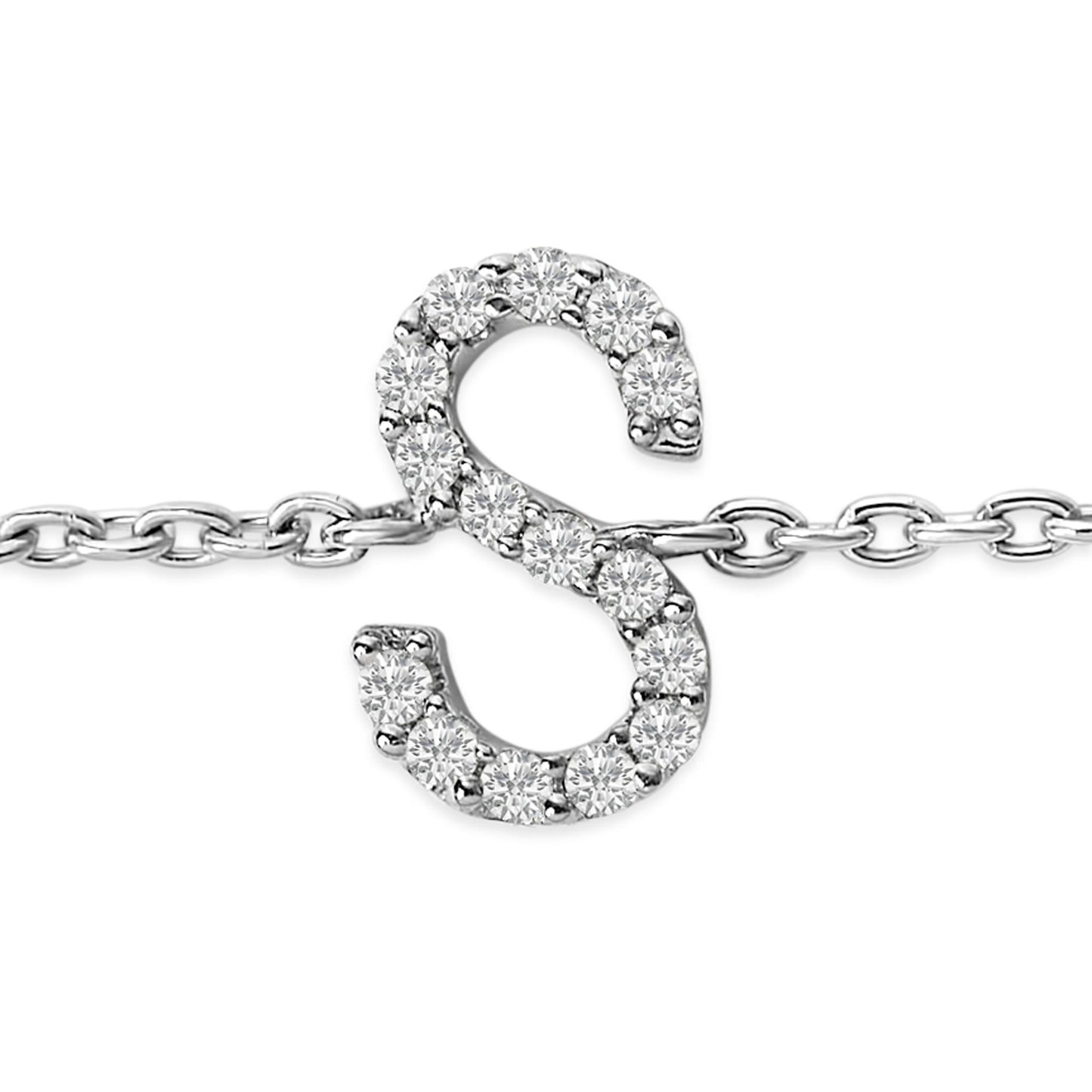 Close-up front view of a white metal bracelet featuring a pendant in the shape of the letter 'S' adorned with round white gemstones in a micro-pave setting. The pendant is attached to a delicate chain.