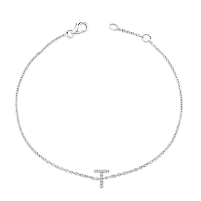 White bracelet with a thin chain and a horizontal T-shaped charm adorned with small round white gemstones in a micro-pave setting, shown flat from above.