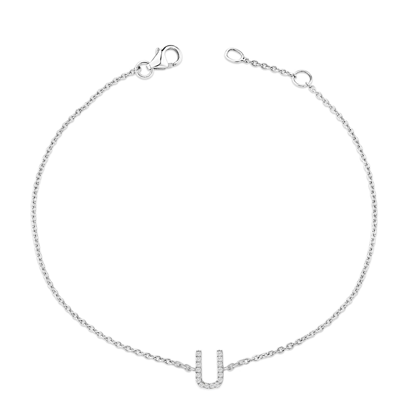 White metal bracelet with a delicate chain and a central U-shaped pendant adorned with round white gemstones in a micro-pave setting, shown from a top-down angle.