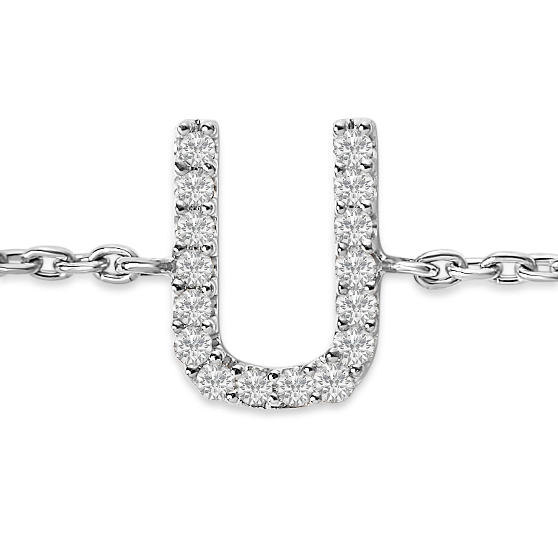 Close-up front view of a white metal bracelet with a U-shaped pendant set with round white gemstones in a micro-pave setting, shown on a white background.