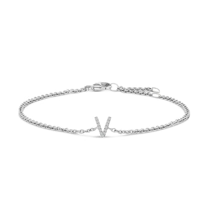 White bracelet with a delicate chain and a V-shaped centerpiece adorned with small white gemstones, shown at a front-facing angle on a white background.