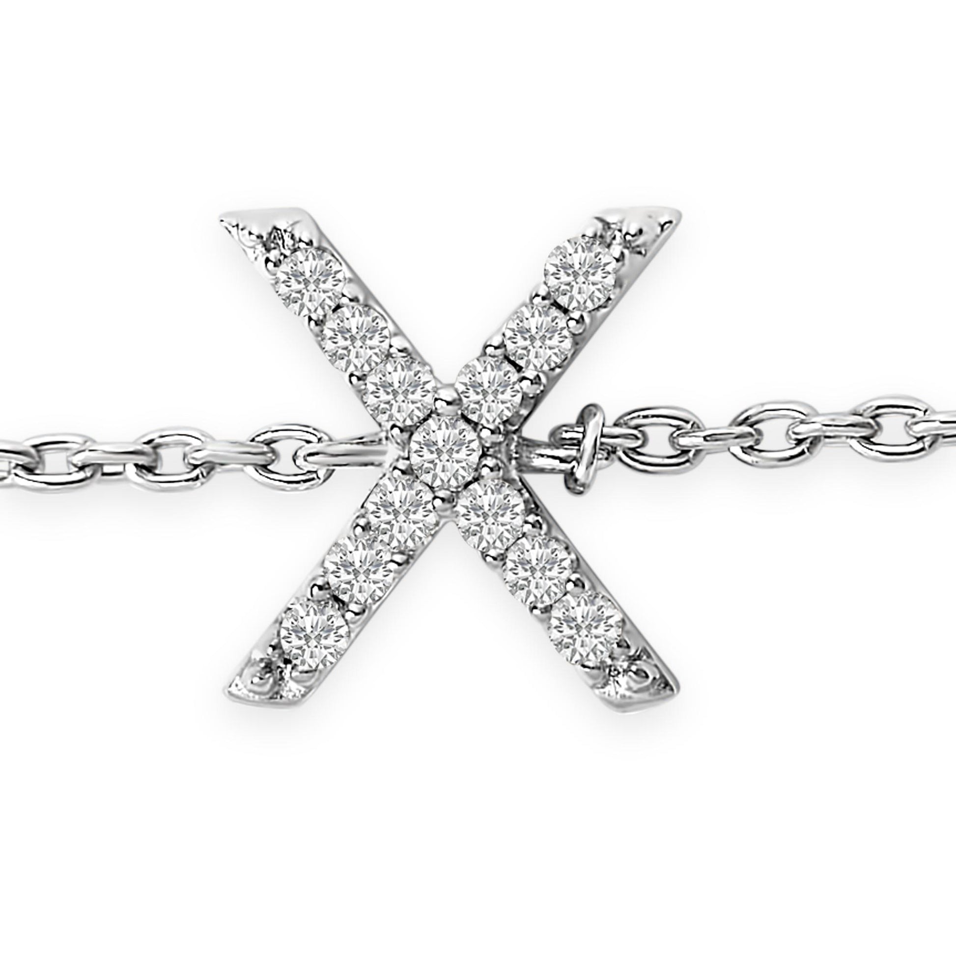Close-up front view of a white bracelet featuring an X-shaped charm with round white gemstones in a micro-pave setting, attached to a linked chain.