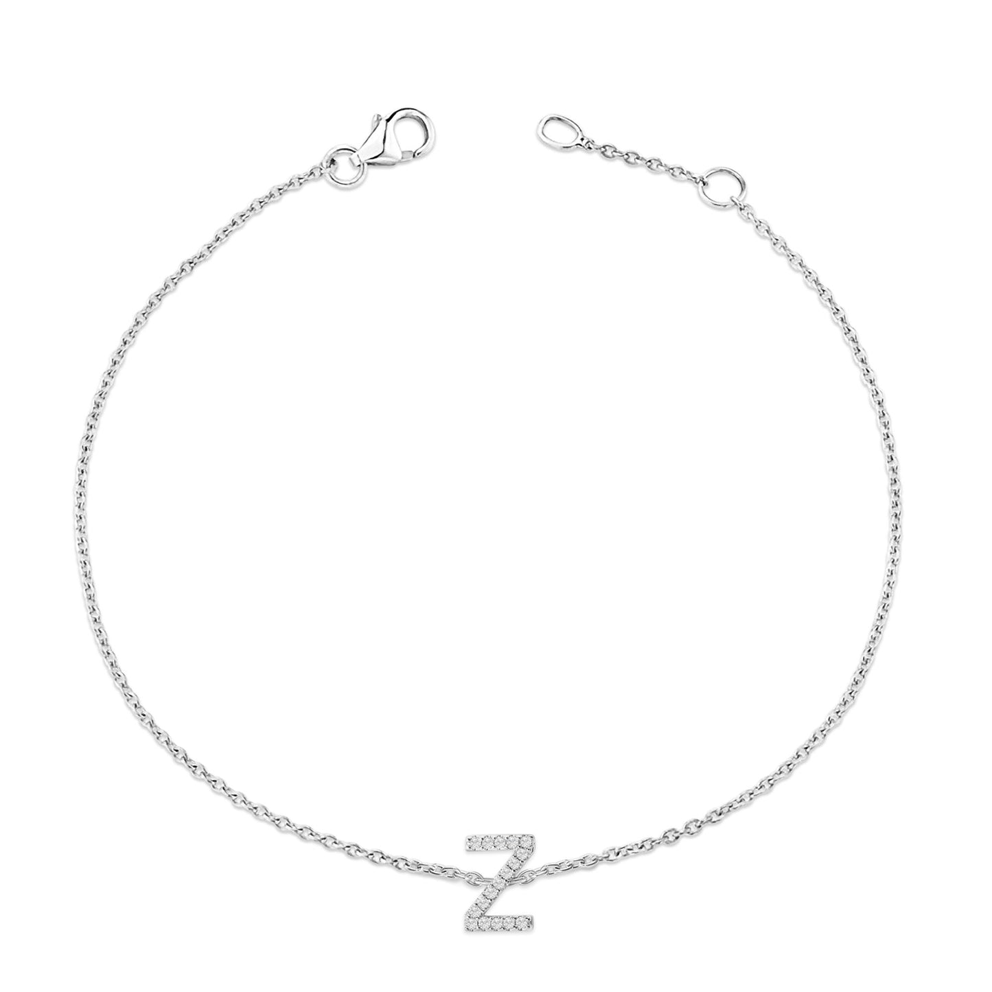 White metal bracelet with a delicate chain and a central 'Z' shaped charm adorned with small white gemstones, shown from a top-down angle on a white background.