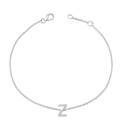 White metal bracelet with a delicate chain and a central 'Z' shaped charm adorned with small white gemstones, shown from a top-down angle on a white background.