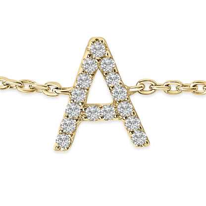 Close-up front view of a yellow metal bracelet featuring a letter A pendant adorned with round white gemstones in a micro-pave setting, shown on a chain.