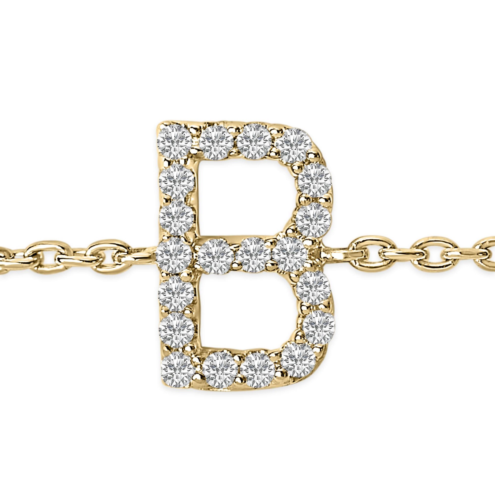 Close-up front view of a yellow metal bracelet featuring a letter 'B' charm adorned with round white gemstones in a micro-pave setting.